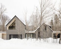 Ski chalet conversion that boasts glass passageway